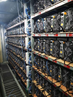 An aerial view of a modern mining farm in India, showcasing rows of hosted machines ready for optimal cryptocurrency extraction