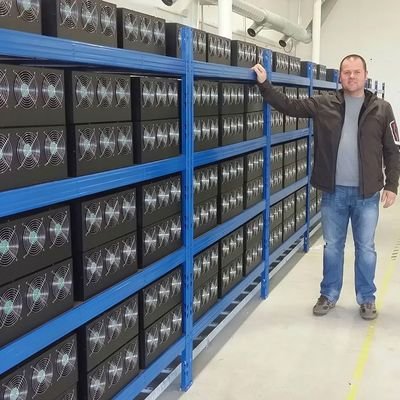 A panoramic view of a large-scale Bitcoin mining farm, showcasing rows of mining rigs and advanced cooling systems.